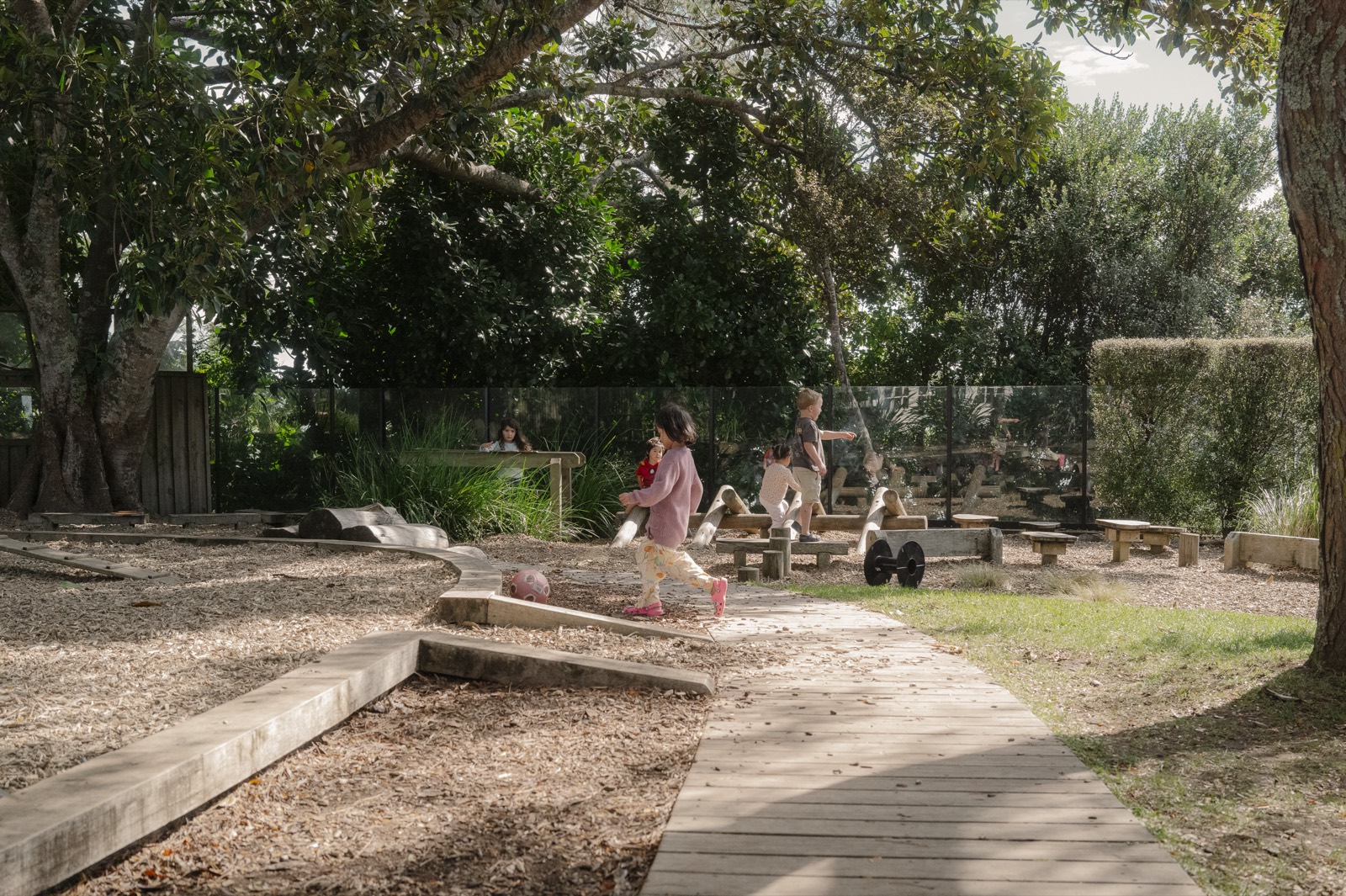 Children playing in a natural garden at a Bear Park centre